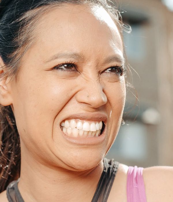 Woman feeling energetic and happy outdoors in nature.